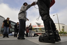 Fans of the late pop star Michael Jackson wait across the street from the Staples Center in Los Angeles, Friday, July 3, 2009 for tickets to Tuesday's memorial service. (AP / Chris Carlson)