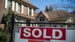 A sold sign is seen outside of a home in this file image. 