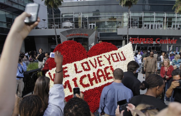 Fans gather outside Staples Center before a memorial service for Michael Jackson in Los Angeles, Tuesday, July 7, 2009. (AP / Jae C. Hong)