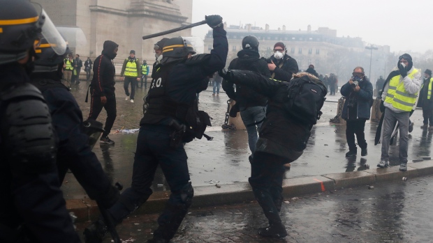 French protesters angry about rising taxes clash with police in Paris ...