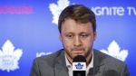 Toronto Maple Leafs defenceman Morgan Rielly looks down during a press conference alongside General Manager Kyle Dubas as they address an NHL investigation into an alleged slur during last night's game against the Tampa Bay Lightning, in Toronto, Tuesday, March 12, 2019. THE CANADIAN PRESS/Cole Burston