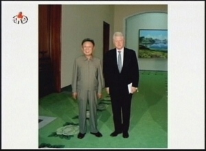 This image made from video broadcast Tuesday, Aug. 4, 2009, by KRT, shows an still photograph of former U.S president Bill Clinton, right, standing with the North Korea's leader Kim Jong II in Pyongyang, North Korea.