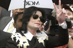 Michael Jackson waves to fans gathered outside of Gary City Hall in Gary, Ind., on Wednesday, June 11, 2003. (AP / Darron Cummings)