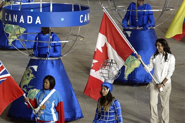 Canada's Alexandra Orlando, from Toronto, carries the Canadian flag into Maracana Stadium at the Pan Am Games closing ceremonies in Rio de Janeiro, Brazil on Sunday, July 29, 2007. (CP / Andrew Vaughan)