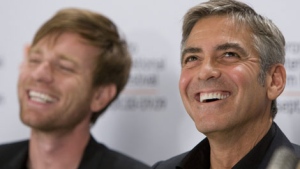 Ewan McGregor (left) and George Clooney smile during the news conference for the movie "Men Who Stare at Goats" in Toronto on Friday, September 11, 2009. (THE CANADIAN PRESS / Frank Gunn)