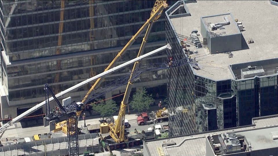 Crews Working To Dismantle Collapsed Crane In Downtown Toronto 