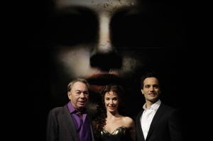 Andrew Lloyd Webber, left, stands with Iranian-born Canadian Ramin Karimloo, right, who plays the Phantom, and Sierra Boggess from U.S., who plays Christine Daae, as they promote his new production 'Love Never Dies' at a theatre in London, Thursday Oct. 8, 2009. (AP / Matt Dunham)