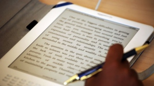 In this photo made Oct. 2, 2009, a student uses a Kindle DX during class at Pace University in New York. (AP Photo/Mark Lennihan)