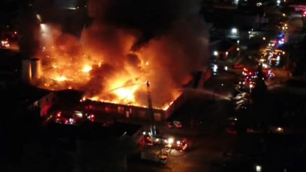 Crews battle 4-alarm fire on Queen Street West, 1 firefighter injured -  Toronto