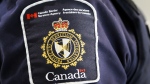 A Canada Border Services Agency (CBSA) patch is seen on an officer in Calgary on August 1, 2019. THE CANADIAN PRESS/Jeff McIntosh 