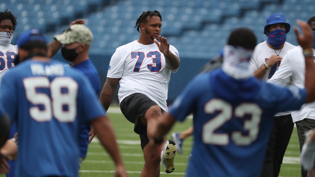 Buffalo Bills offensive tackle Dion Dawkins (73) warms up before