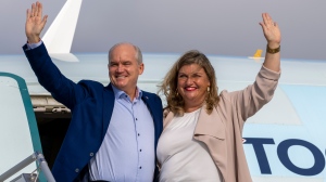 Conservative Leader Erin O'Toole and his wife Rebecca wave from the steps of the airplane prior to departing Ottawa on Friday, September 10, 2021. Canadians will vote in a federal election Sept. 20th. THE CANADIAN PRESS/Frank Gunn 