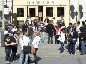 Students hang out in front of the entrance to Dawson College in Montreal. (CP / Ryan Remiorz)