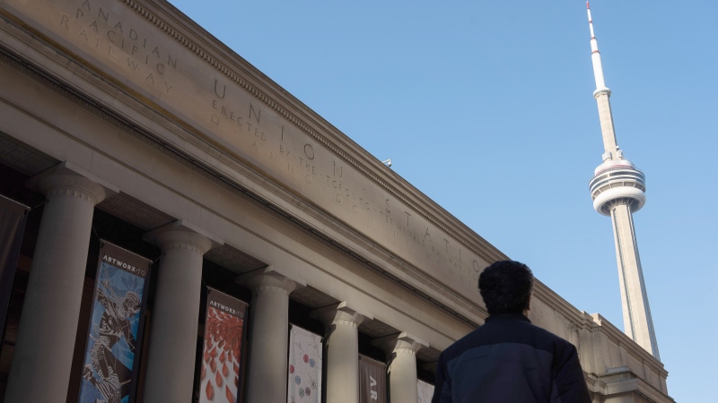 A man walks past the entrance to Union Station in Toronto, April 20, 2022. (THE CANADIAN PRESS/Yader Guzman)