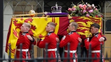 Pallbearers carry the coffin of Queen Elizabeth II