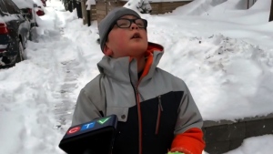 After a massive snowstorm hit Southern Ontario, Carter Trozzolo was out shovelling and wishing he was in school instead. 