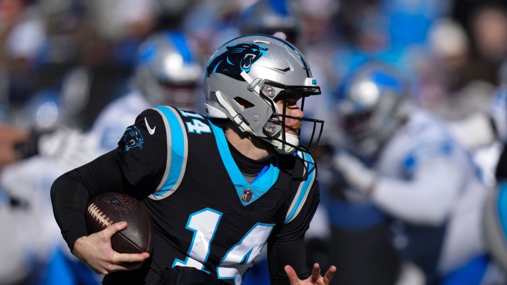 Charlotte, NC USA; Carolina Panthers quarterback Sam Darnold (14) runs in  for a touchdown during an NFL game against the Detroit Lions at Bank of  America Stadium, Saturday, December 24, 2022. The