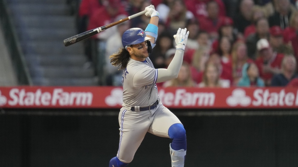 May 3, 2022, TORONTO, ON, CANADA: Toronto Blue Jays catcher Alejandro Kirk  (30) hits a double against the New York Yankees during fifth inning  American League MLB baseball action in Toronto on