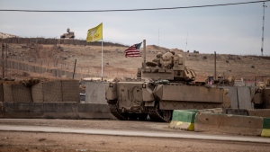 American soldiers patrol near a prison that was attacked on Jan. 20 by the Islamic State militants in Hassakeh, Syria, Feb. 8, 2022. (AP Photo/Baderkhan Ahmad, File)