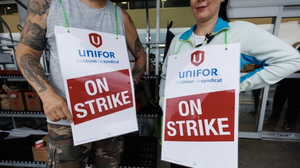 striking workers outside Metro