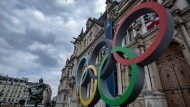 FILE - The Olympic rings are seen in front of the Paris City Hall, in Paris, on April 30, 2023. 