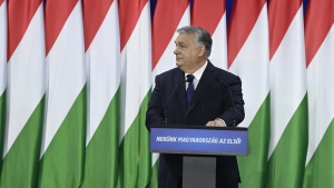Hungary's Prime Minister Viktor Orban delivers his annual "State of Hungary" speech in Budapest, Hungary, Saturday, Feb. 17, 2024. The message on lectern reads: "For us Hungary is the first!" (Szilard Koszticsak/MTI via AP)