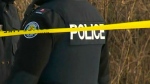 A Toronto police badge and police tape can be seen in this undated file photo.