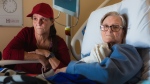 Michele Campeau, left, visits with her mother, Ruth Poupard, 83, at Hotel-Dieu Grace Healthcare where she is recovering from a broken hip, in Windsor, Ont., on Wednesday, April 3, 2024. THE CANADIAN PRESS/Dax Melmer
