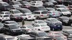 A person walks through a parking lot at a shopping mall on Dec. 8, 2016 in King of Prussia, Pa. Many newer cars use wireless key fobs and push-button starters. The technology makes it more convenient to get into your vehicle, but it also makes things easier for thieves. (AP Photo/Matt Rourke, File)