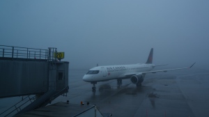 An Air Canada plane taxis towards the gate in poor weather conditions at Halifax Airport, in Halifax, Wednesday, March 27, 2024. THE CANADIAN PRESS/Chris Young