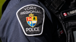 A police badge is visible on a York Regional Police officer's uniform. (Source: YRP/X)