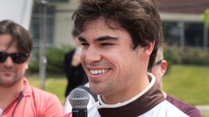 Aston Martin Formula One driver Lance Stroll, from Canada, speaks to the media after the filming of a Tim Hortons commercial ahead of the Canadian Grand Prix, in Montreal, Wednesday, June 5, 2024. THE CANADIAN PRESS/Ryan Remiorz 