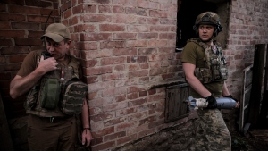 Ukrainian soldiers prepare to fire 120mm mortar towards Russian position on the front line at undisclosed location in Donetsk region, Ukraine, Monday, June 4, 2024. (Oleg Petrasiuk/Ukrainian 24 Mechanised brigade via AP)