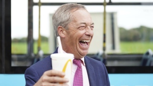 Leader of Reform U.K. Nigel Farage holds a McDonalds banana milkshake in Jaywick, Essex, England, Tuesday June 4, 2024. (James Manning / PA)