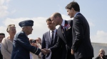 Prince William, the Prince of Wales greets 100-year-old Canadian veteran Richard Rohmer, accompanied by the Prime Minister of France Gabriel Attal and Prime Minister Justin Trudeau, at a ceremony to mark the 80th anniversary of D-Day, at Juno Beach in Courseulles-sur-Mer, Normandy, France, Thursday, June 6, 2024. THE CANADIAN PRESS/Adrian Wyld