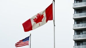American and Canadian flags fly outside the United States consulate on the day of the U.S. presidential election during the COVID-19 pandemic in Toronto on Tuesday, November 3, 2020. THE CANADIAN PRESS/Nathan Denette
