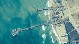 U.S. and Israel military forces place the Trident Pier on the coast of Gaza Strip on May 16, 2024. (U.S. Central Command via AP)