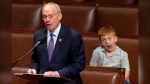 Rep. John Rose speaks Monday, June 3, 2024 in Washington as his son Guy makes a face. (House Television via AP)