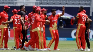 Canada players celebrate their victory by 12 runs over Ireland at an ICC Men's T20 World Cup cricket match at the Nassau County International Cricket Stadium in Westbury, New York, Friday, June 7, 2024. (AP Photo/Adam Hunger) 