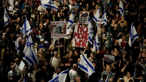 People protest against Israeli Prime Minister Benjamin Netanyahu's government and call for the release of hostages held in the Gaza Strip by the Hamas militant group, in Tel Aviv, Israel, on May 18, 2024. (Leo Correa/AP Photo) 