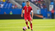 Canada midfielder Stephen Eustaquio (7) runs with the ball during the second half of a CONCACAF Nations League Play-In soccer match between Trinidad And Tobago and Canada, Saturday, March 23, 2024, in Frisco, Texas. (The Canadian Press / Julio Cortez)