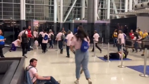 Volunteers act out a simulated response to a bomb threat in one of Toronto Pearson's terminals on Saturday night.(@TorontoPearson/Twitter)