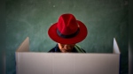 A voter fills out a ballot paper during general elections in Nkandla, Kwazulu Natal, South Africa, Wednesday May 29, 2024. (AP Photo/Emilio Morenatti)