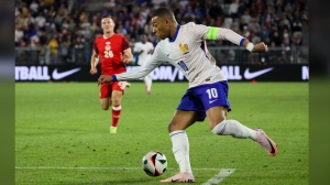 France's Kylian Mbappe controls the ball during the international friendly soccer match between France and Canada at the Matmut Atlantique stadium in Bordeaux, southwestern France, Sunday, June 9, 2024. (AP Photo/Yohan Bonnet)