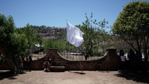 A peace flag flutters on the fence of a church, where a gang leader killed two Jesuit priests in 2022, in Cerocahui, Mexico on May 12, 2024. (Eduardo Verdugo / AP Photo)