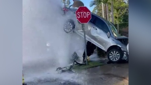 Car lifted into air by blown fire hydrant