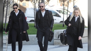 Lawyer Leonard Tailleur, centre, lawyer for accused serial killer Jeremy Skibicki, enters the Manitoba Law Courts for the trial of Skibicki in Winnipeg on Wednesday, May 8, 2024. THE CANADIAN PRESS/John Woods