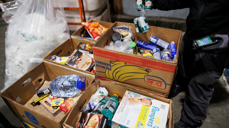 For grocers, selling perishable items means making continual choices about every item on display – especially the ones nearing the end of their shelf life. Food and goods are sorted to be sent to a food bank at a Metro grocery store In Toronto on Friday, Feb. 2, 2024. For those that don’t sell in time, many stores donate them to food banks rather than throw them away. THE CANADIAN PRESS/Cole Burston