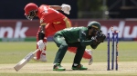 Pakistan's Mohammad Rizwan, right, breaks the stumps in an attempt to run-out Canada's Shreyas Movva, left, during the ICC Men's T20 World Cup cricket match between Pakistan and Canada at the Nassau County International Cricket Stadium in Westbury, New York, Tuesday, June 11, 2024. THE CANADIAN PRESS/AP, Adam Hunger