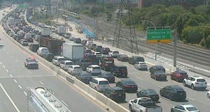 Police close off a stretch of the westbound Gardiner Expressway following a collision involving two dump trucks near Spadina Avenue Tuesday June 11, 2024. 